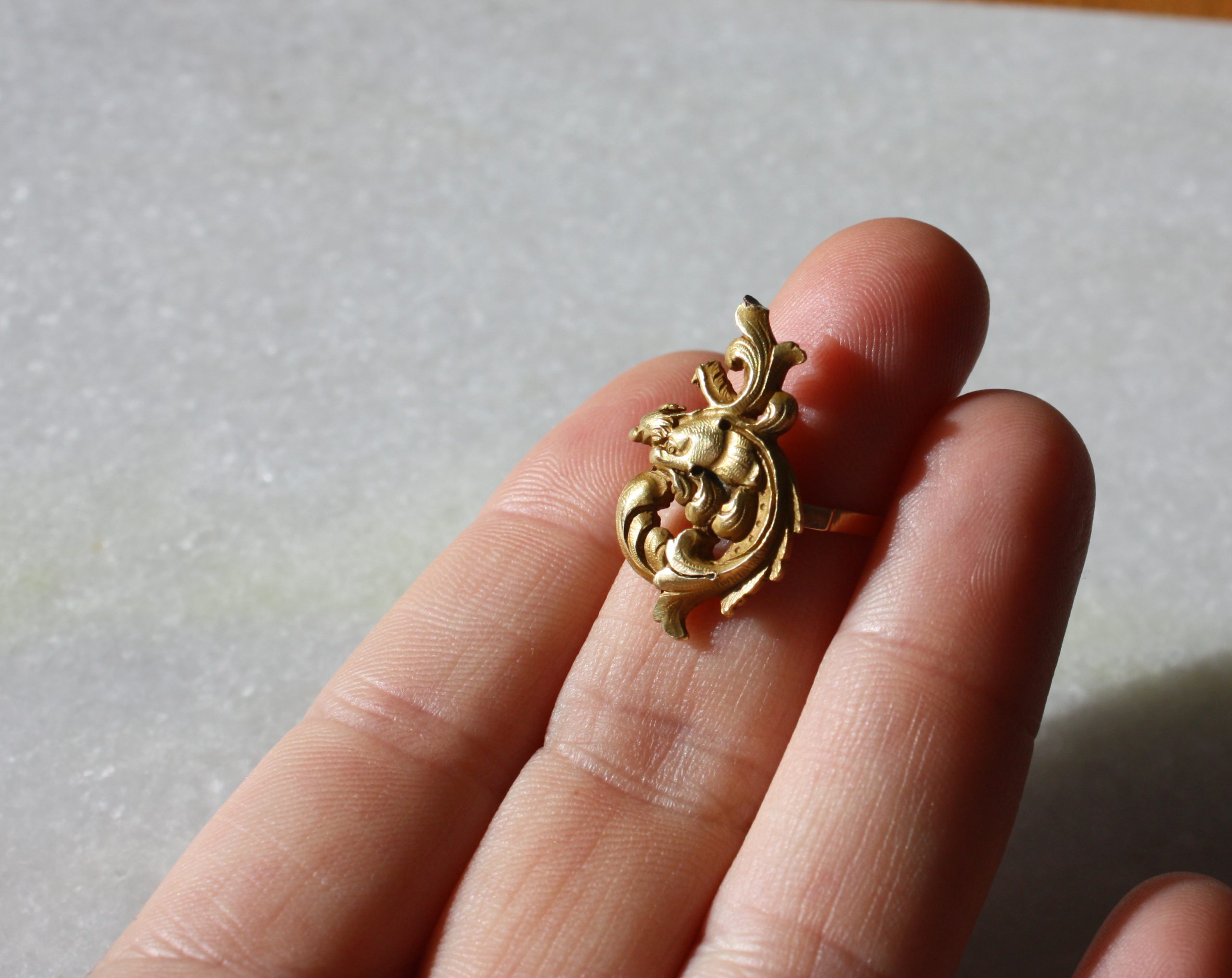 Unique piece, a fantastic antique french chimera ring in 18K gold, in Art Nouveau, under the sun light.